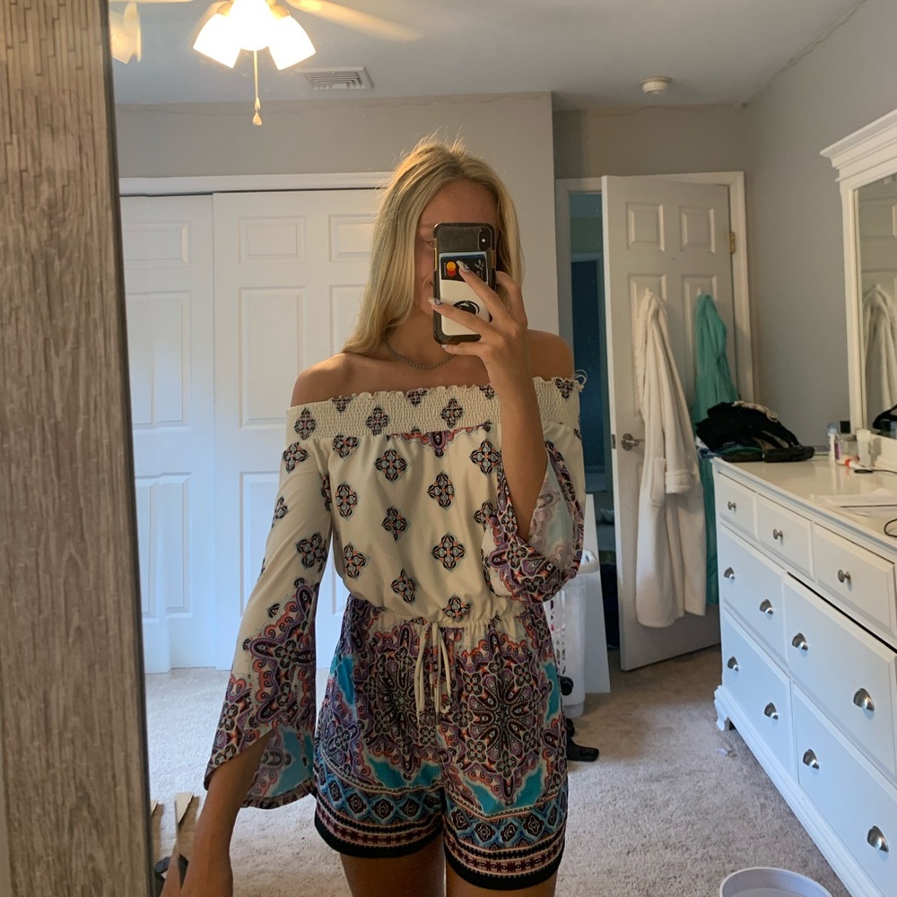 white fading into colorful patterned romper